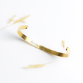 Custom_Engraved_Stainless_Steel_Cuff_Bra_Gold_Lifestyle_01_Mockup.png